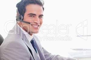 Side view of smiling businessman with headset on