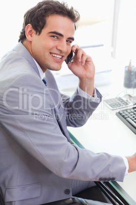 Side view of businessman talking on his cellphone