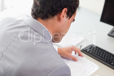 Above view of businessman doing paper work