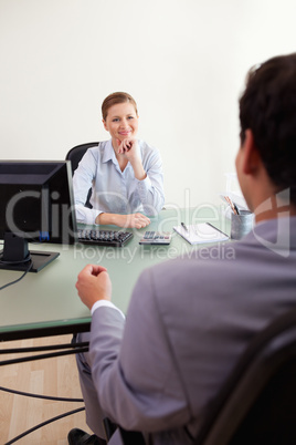 Businesswoman listening to client