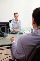 Businesswoman listening to client