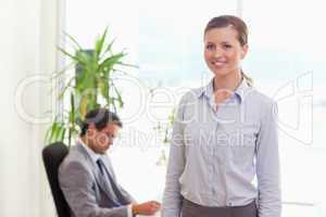 Tradeswoman with colleague behind her