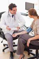 Doctor is relieved after taking his patients blood pressure