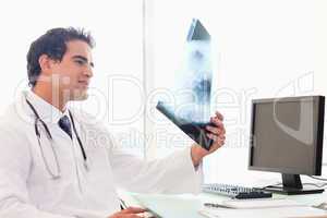 Doctor looking at x-ray