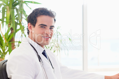 Side view of smiling doctor