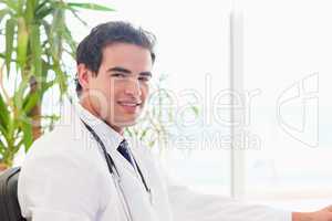 Side view of smiling doctor