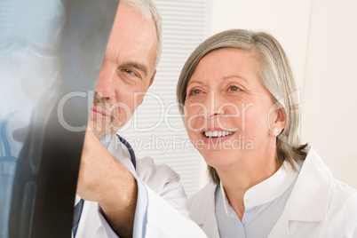 Medical team senior doctors look at x-ray