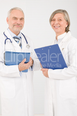 Medical doctor team seniors smiling hold folders