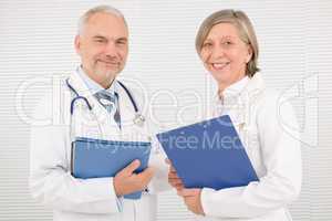 Medical doctor team seniors smiling hold folders