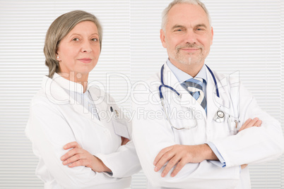 Medical team seniors standing cross arms together