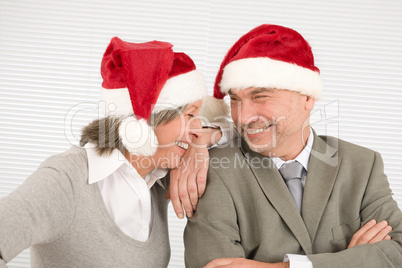 Christmas hat senior businesspeople laugh together