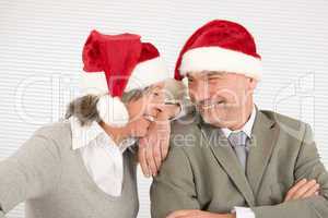 Christmas hat senior businesspeople laugh together