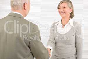 Senior businesspeople handshake professional smile