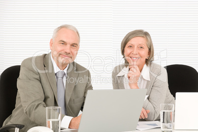 Senior businesspeople working computer in office