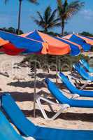 Sunchairs And Umbrellas On The Beach