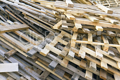 piled into a heap of wooden pallets