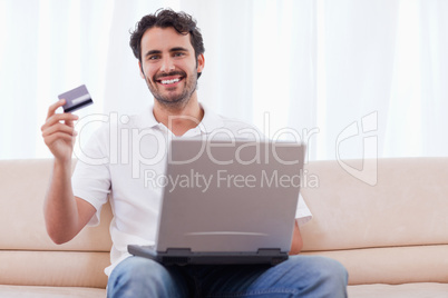 Happy man buying online