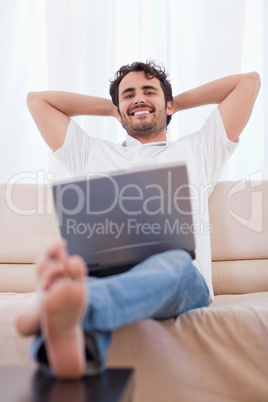 Portrait of a young man using a laptop