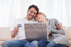 Happy couple shopping online