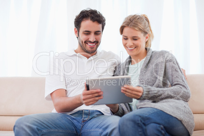 Couple using a tablet computer