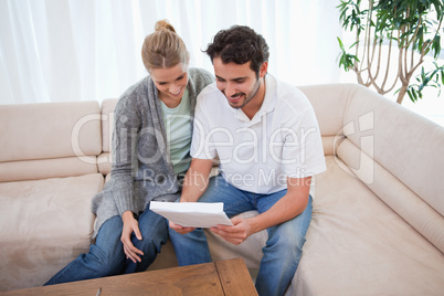 Couple reading a letter
