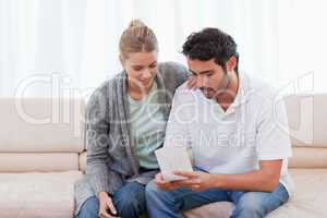 Couple opening an envelope