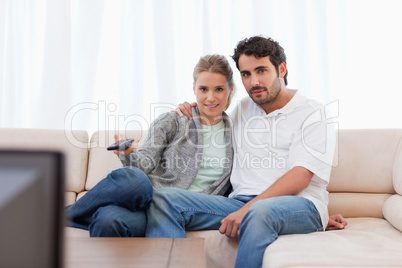 Lovely couple watching TV