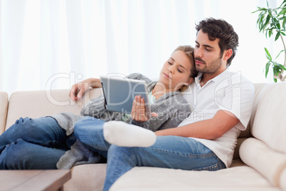 Lovely couple using a tablet computer