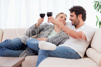 Young couple having a glass of wine