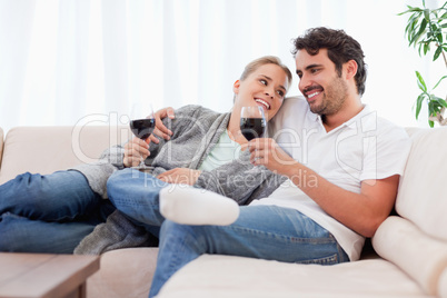 Couple drinking a glass of  red wine