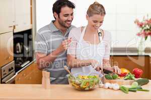 Couple slicing vegetables