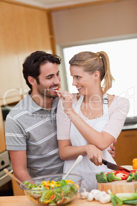 Portrait of a lovely couple cooking