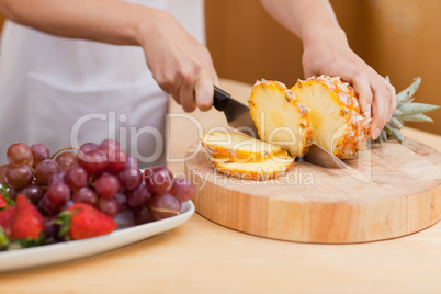 Close up of a pineapple being sliced