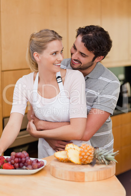 Portrait of a couple eating fruits