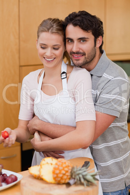 Portrait of an in love couple eating fruits