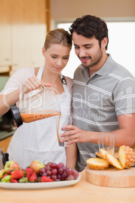 Portrait of a couple drinking fruits juice