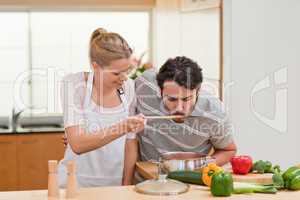 Couple preparing a sauce