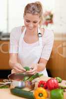 Portrait of a young woman cooking