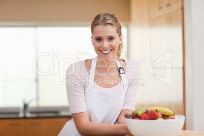 Woman posing with a fruit basket