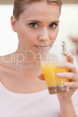 Portrait of a woman drinking juice