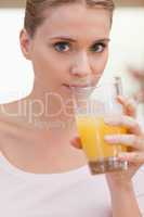 Portrait of a woman drinking juice