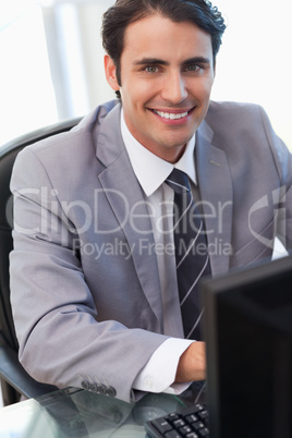 Portrait of a businessman working with a computer