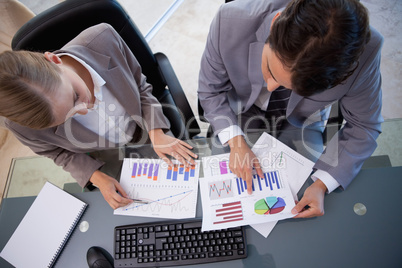 Young business team looking at statistics