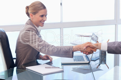 Young businesswoman receiving a customer
