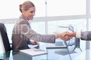 Young businesswoman receiving a customer