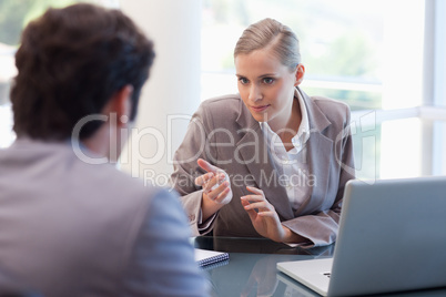 Professional businesswoman receiving a customer