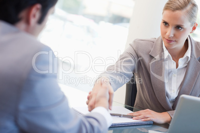 Serious manager interviewing a male applicant