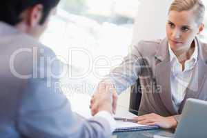 Serious manager interviewing a male applicant