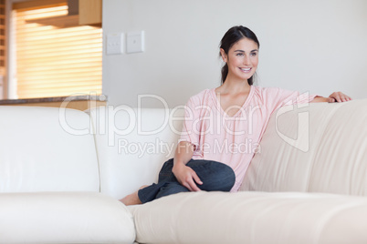 Woman sitting on a sofa