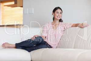 Smiling woman sitting on a couch